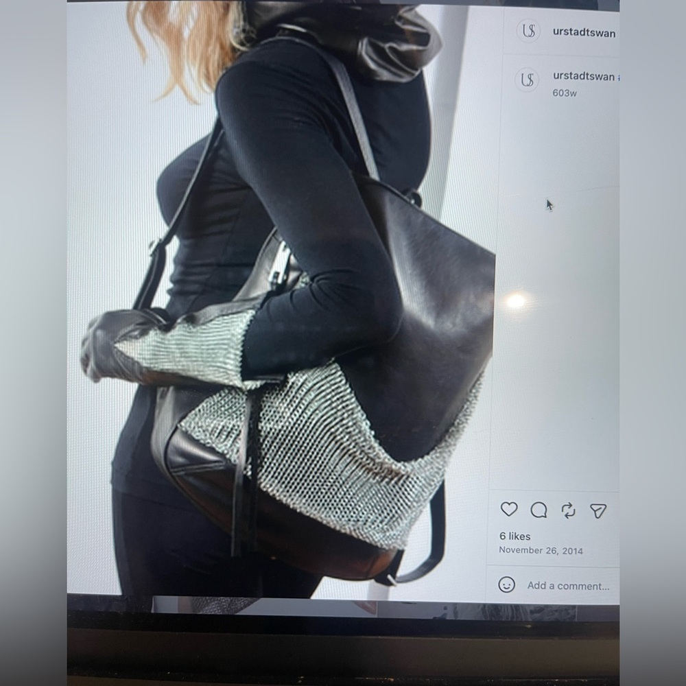 Urstadt.Swan leather backpack with mesh chain detail
